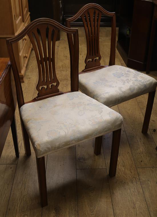 A set of six Hepplewhite style mahogany dining chairs